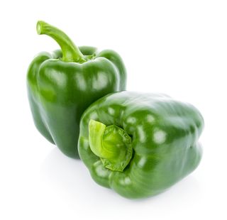 Close-Up Of Bell Peppers Against White Background