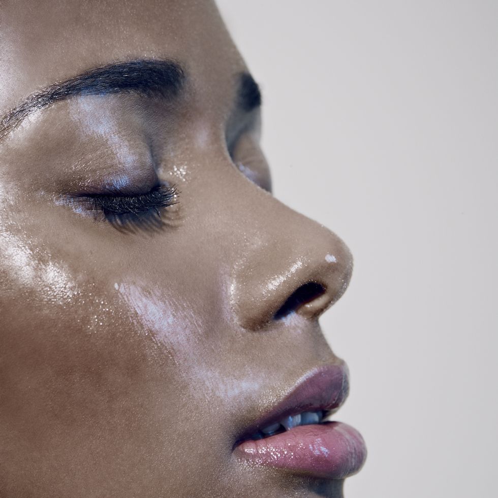 close up of black females face with closed eyes