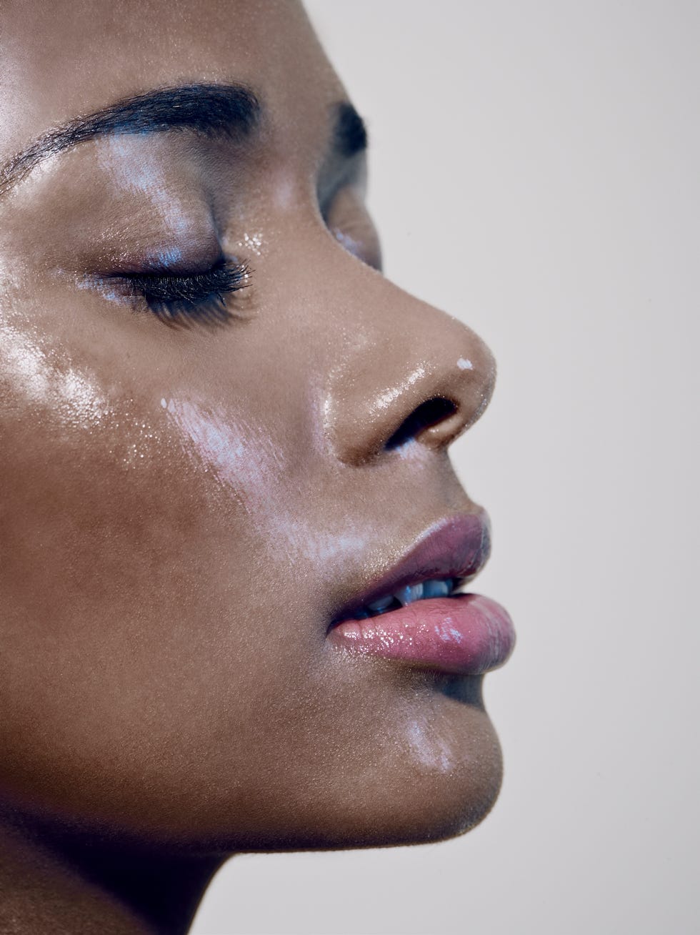 close up of black females face with closed eyes