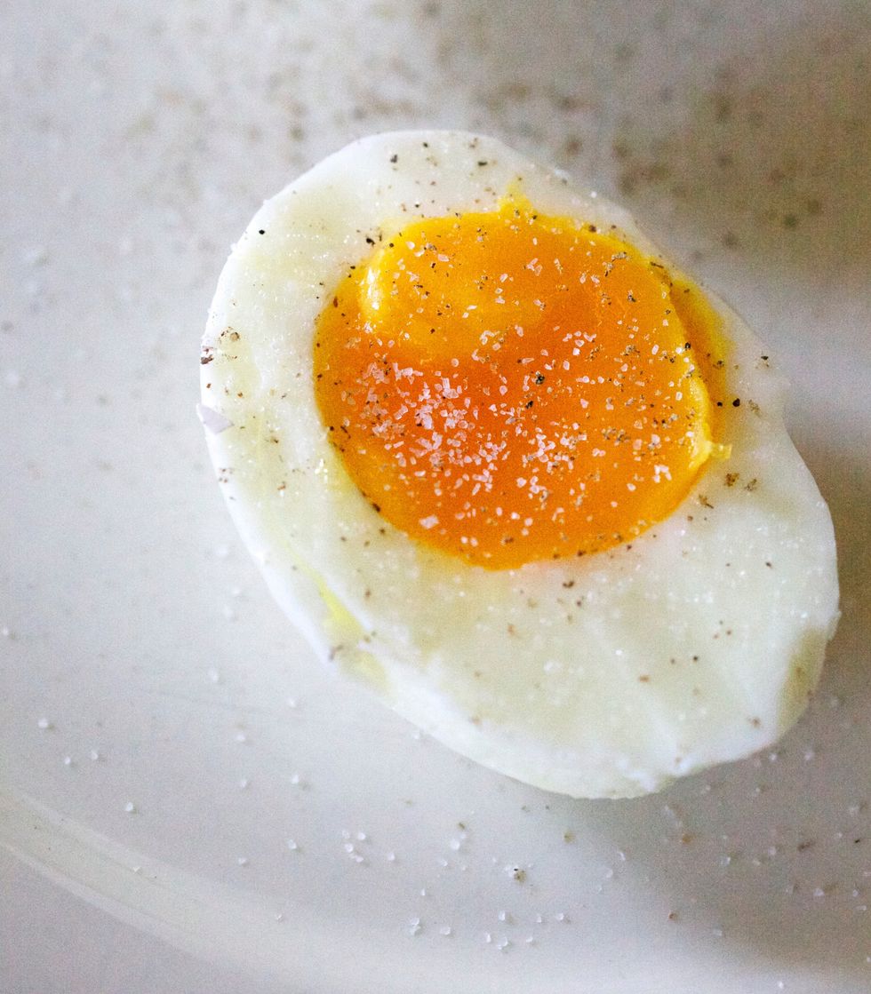 close up of boiled egg slice in plate