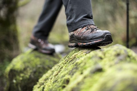 close up of boots on a mossy rock