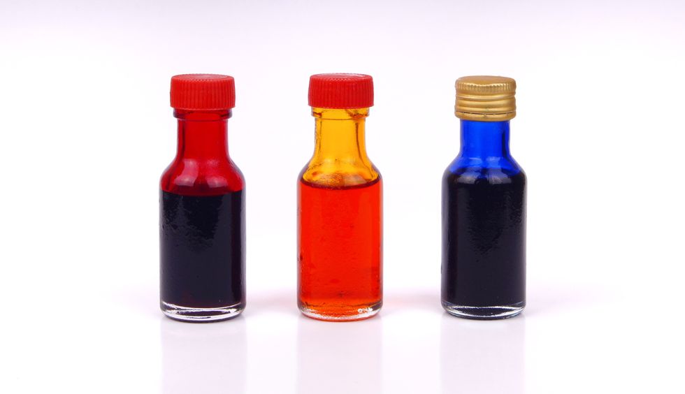 close up of bottles against white background