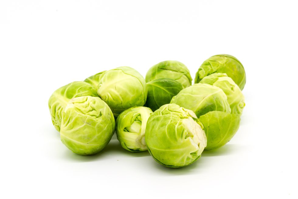 close up of brussels sprouts against white background