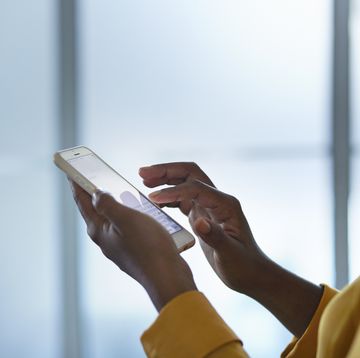 close up of businesswomans hands holding phone