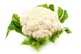 Close-Up Of Cauliflower Against White Background