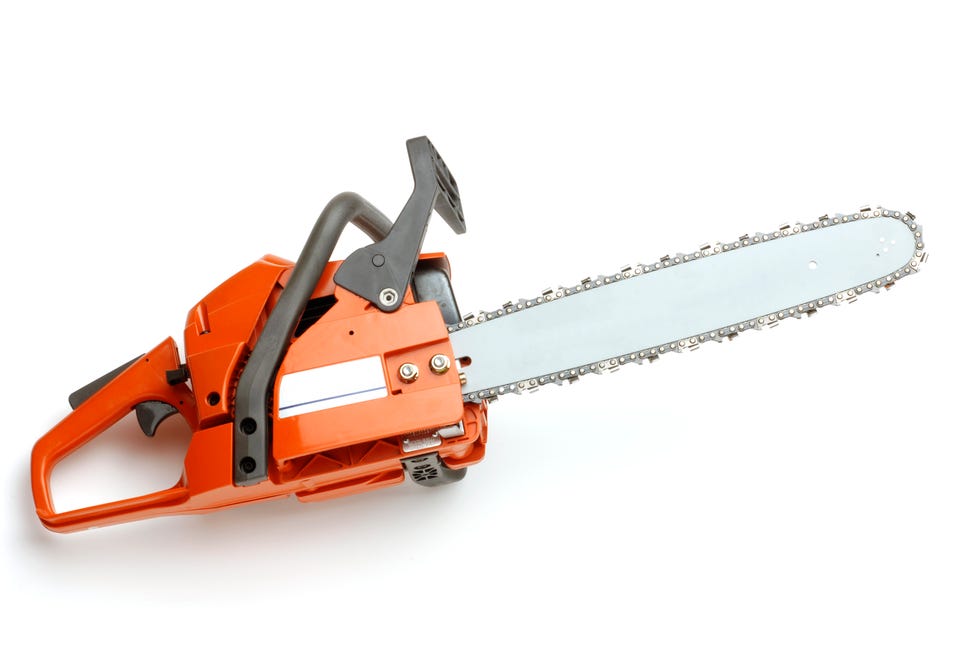 close up of chainsaw over white background