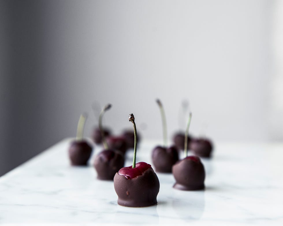 close up of chocolate covered cherries on table