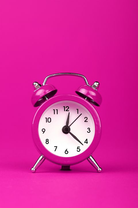 Close-Up Of Clock On Pink Background