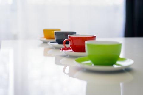close up of colorful coffee cups on table