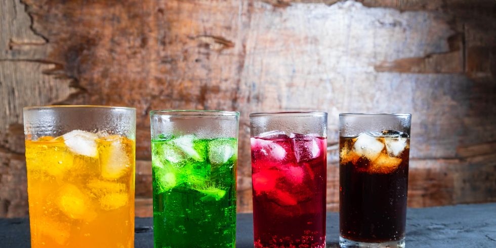 close up of colorful drinks on table