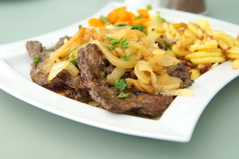 Close-Up Of Cooked Beef Liver In Plate On Table