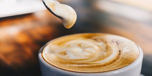 close up of creamy surface of hot latte coffee