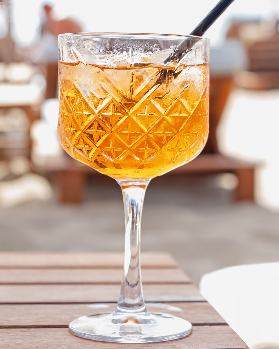 close up of crystal glass with orange drink