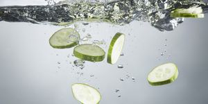 closeup of cucumber slices in splashing water