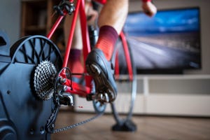 close up of cyclist exercising at home