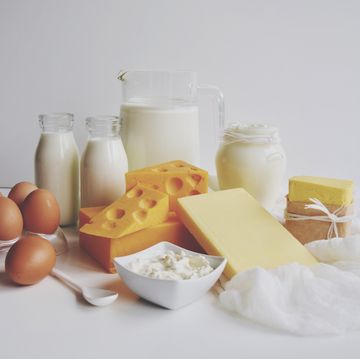 Close-Up Of Dairy Products On Table Against White Background