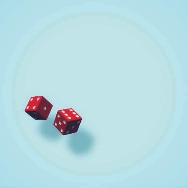 Close-Up Of Dices On Blue Background