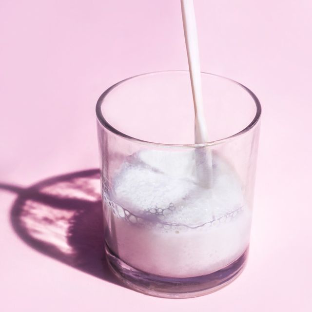 Close-Up Of Drink In Glass On Pink Table