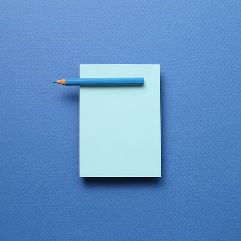 blue notebook and pen