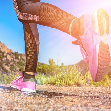 close up of female legs hiking running