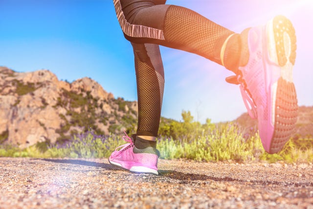 close up of female legs hiking running