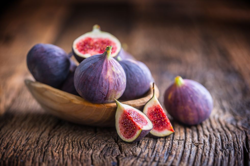 close up of figs on wooden table