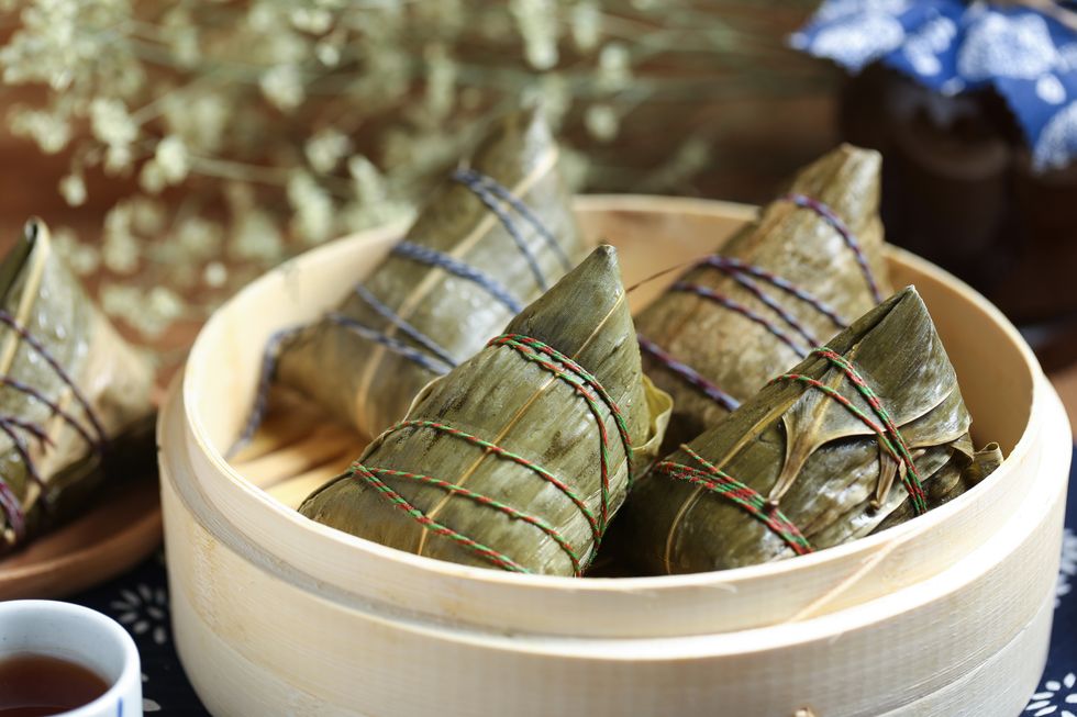 closeup of food wrapped in leaves on table