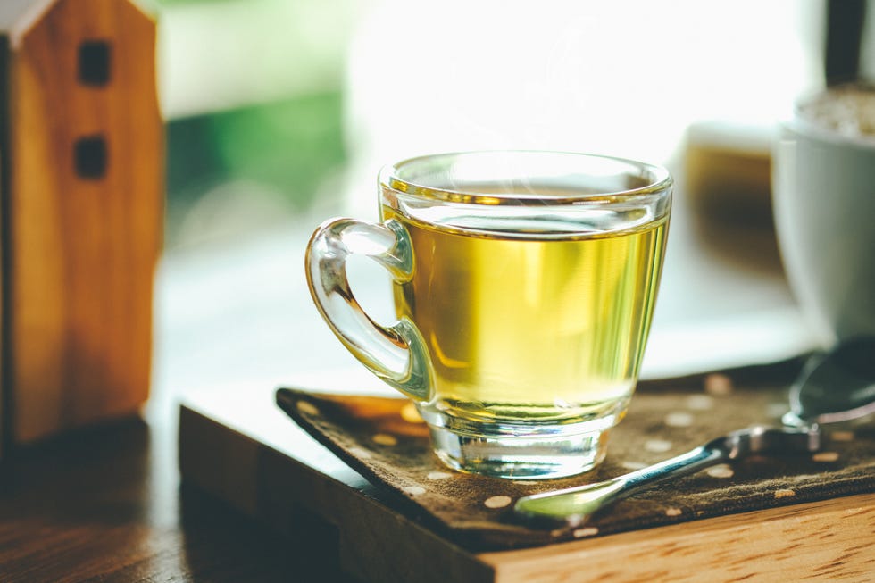 how to look younger closeup of green tea in cup on table