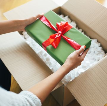 close up of hands holding gift box