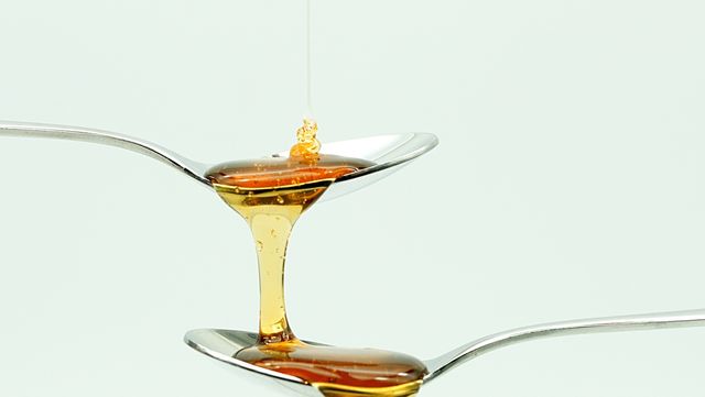 Close-Up Of Honey Against White Background