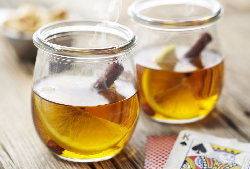 Close-up of hot toddy served in glass mugs on table