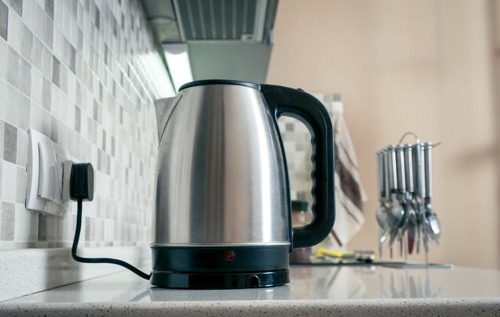 close up of steel kettle on kitchen counter