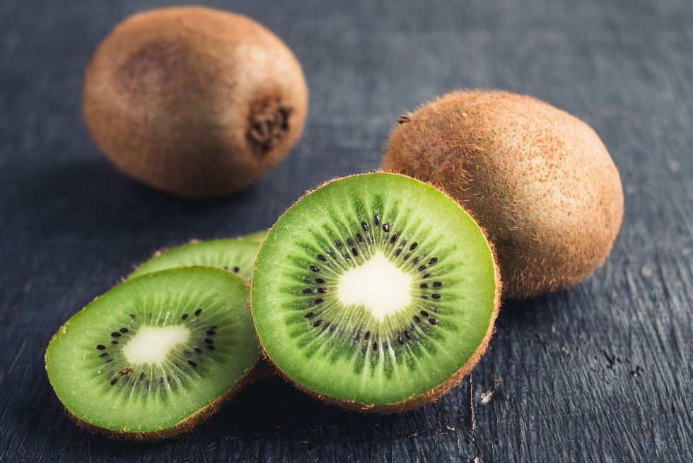 close up of kiwi fruits on table