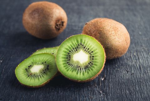 Close-Up Of Kiwi Fruits On Table