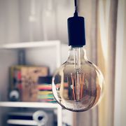 Close-Up Of Light Bulb Hanging At Home