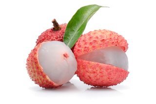 Close-Up Of Lychee Against White Background