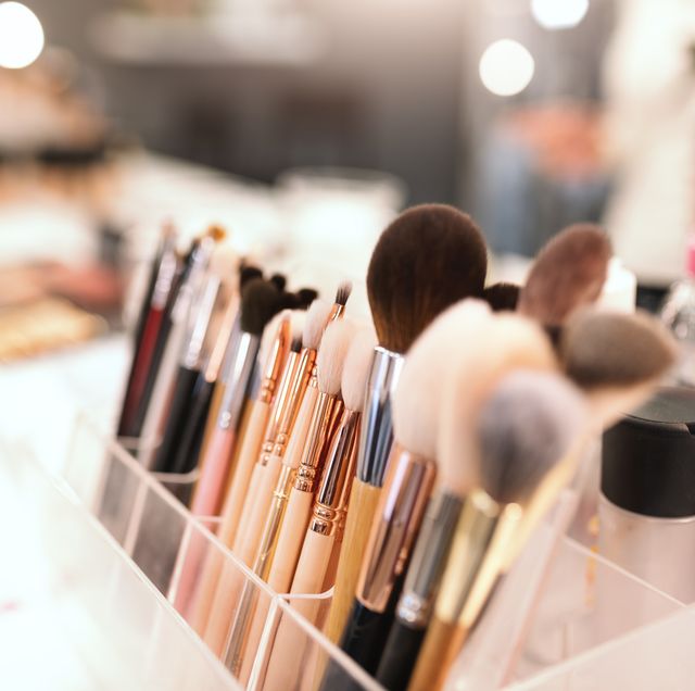 close up of makeup brushes on desk selective focus on brushes