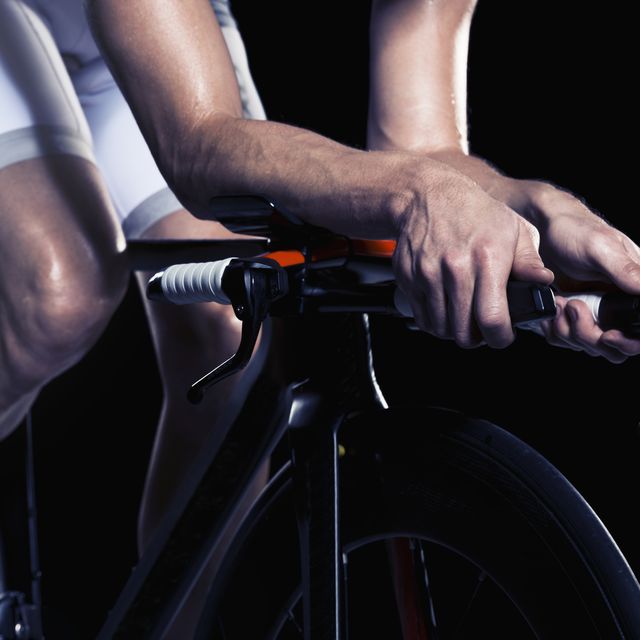 Close-up of man cycling, studio shot