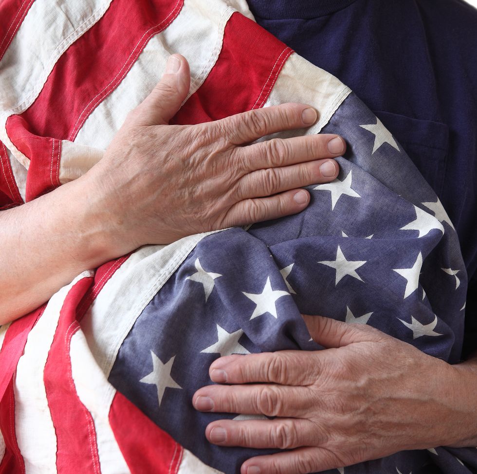 close up of man holding american flag