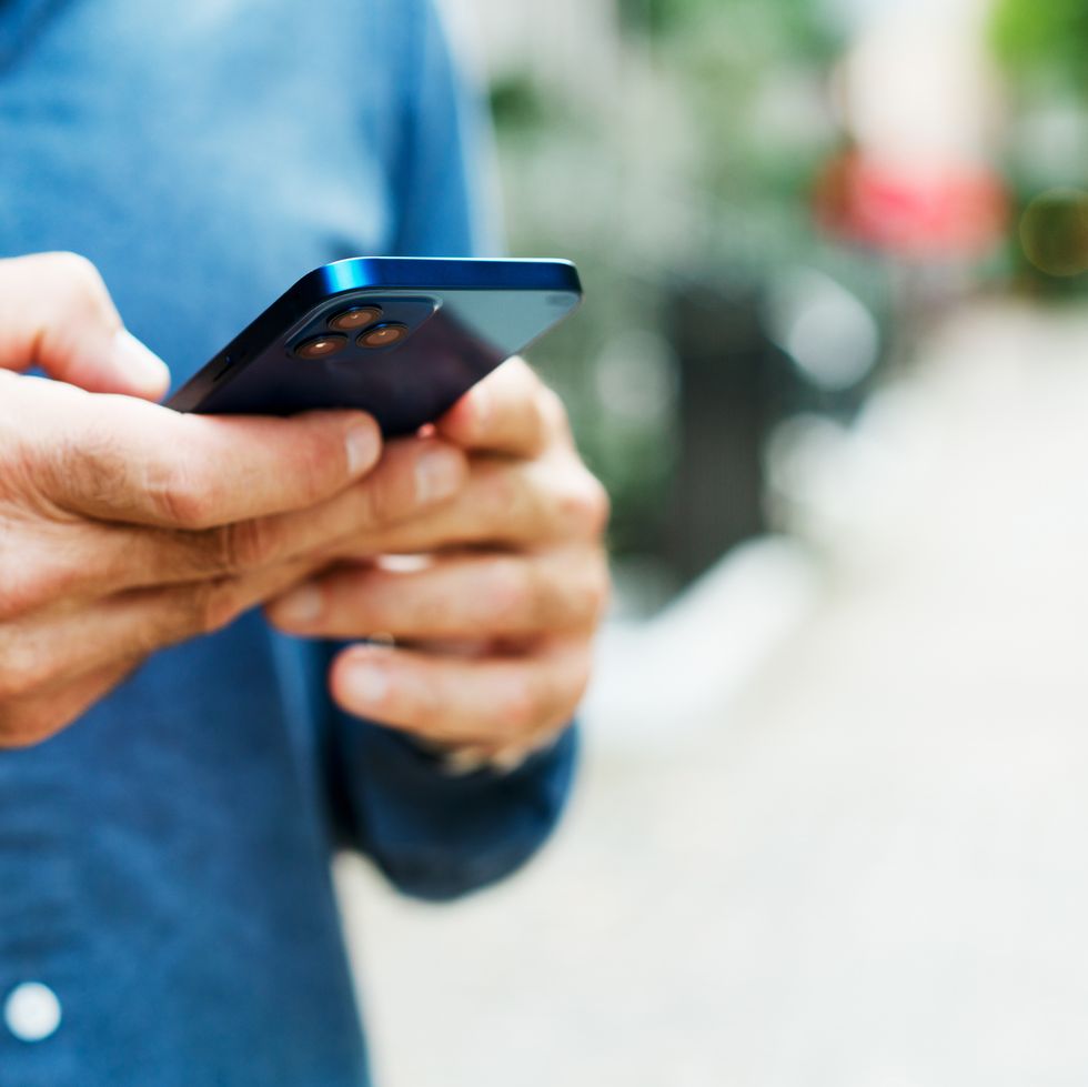 close up of man using smart phone