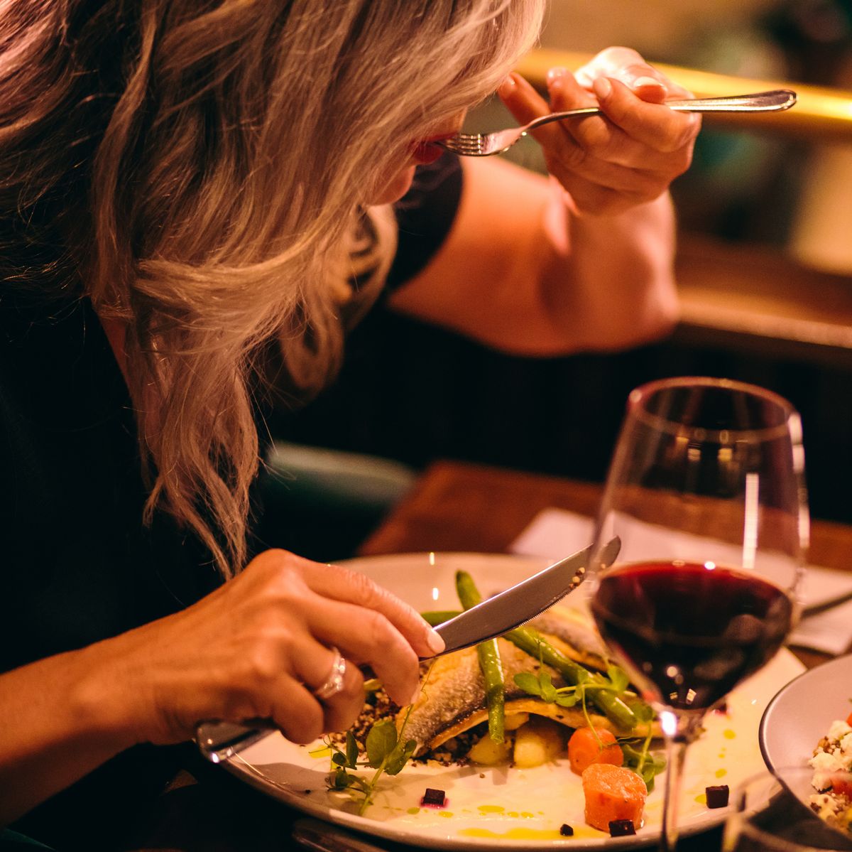 Close-up of mature woman healthy dinner at luxurious restaurant