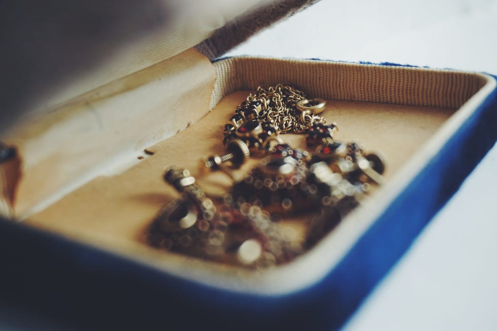 Close-Up Of Old-Fashioned Jewelry In Box On White Background old fashioned jewelry in box on white background