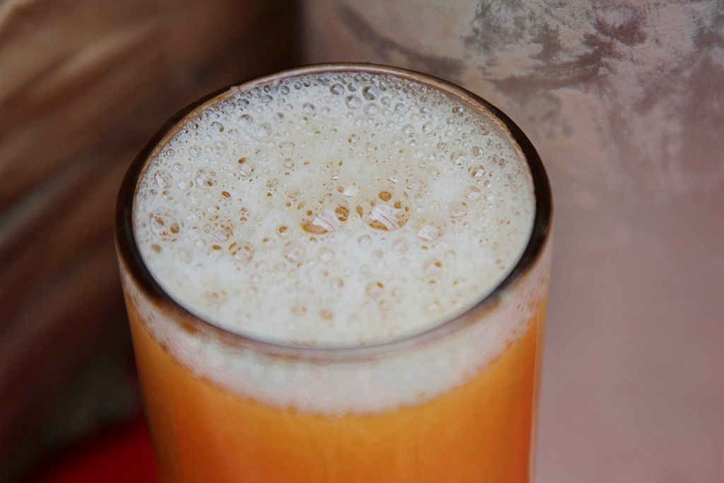 close up of orange juice in a glass