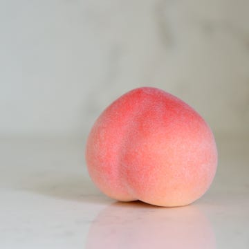 Close-Up Of Peach On Table Close-Up Of Peach On Table