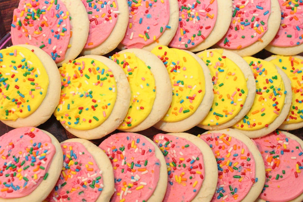 a close up of pink and yellow sprinkled cookies from jameson inn