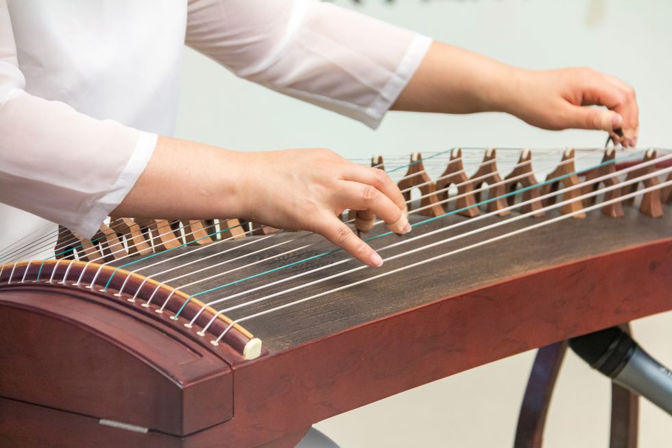 close up of playing guzheng