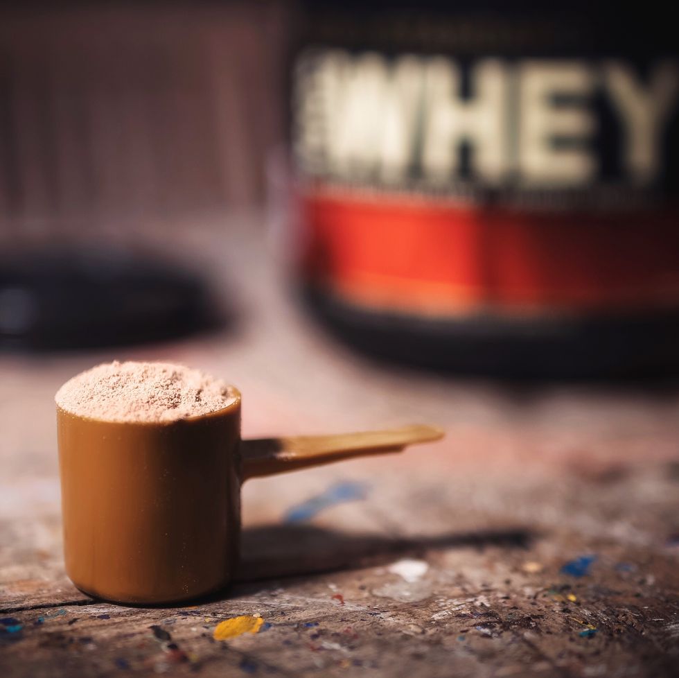 close up of protein powder in scoop on table