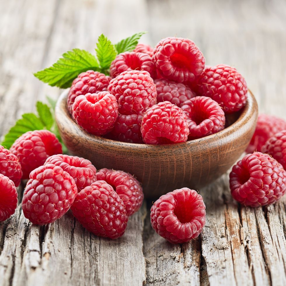 close up of raspberries on wooden table,united states,usa