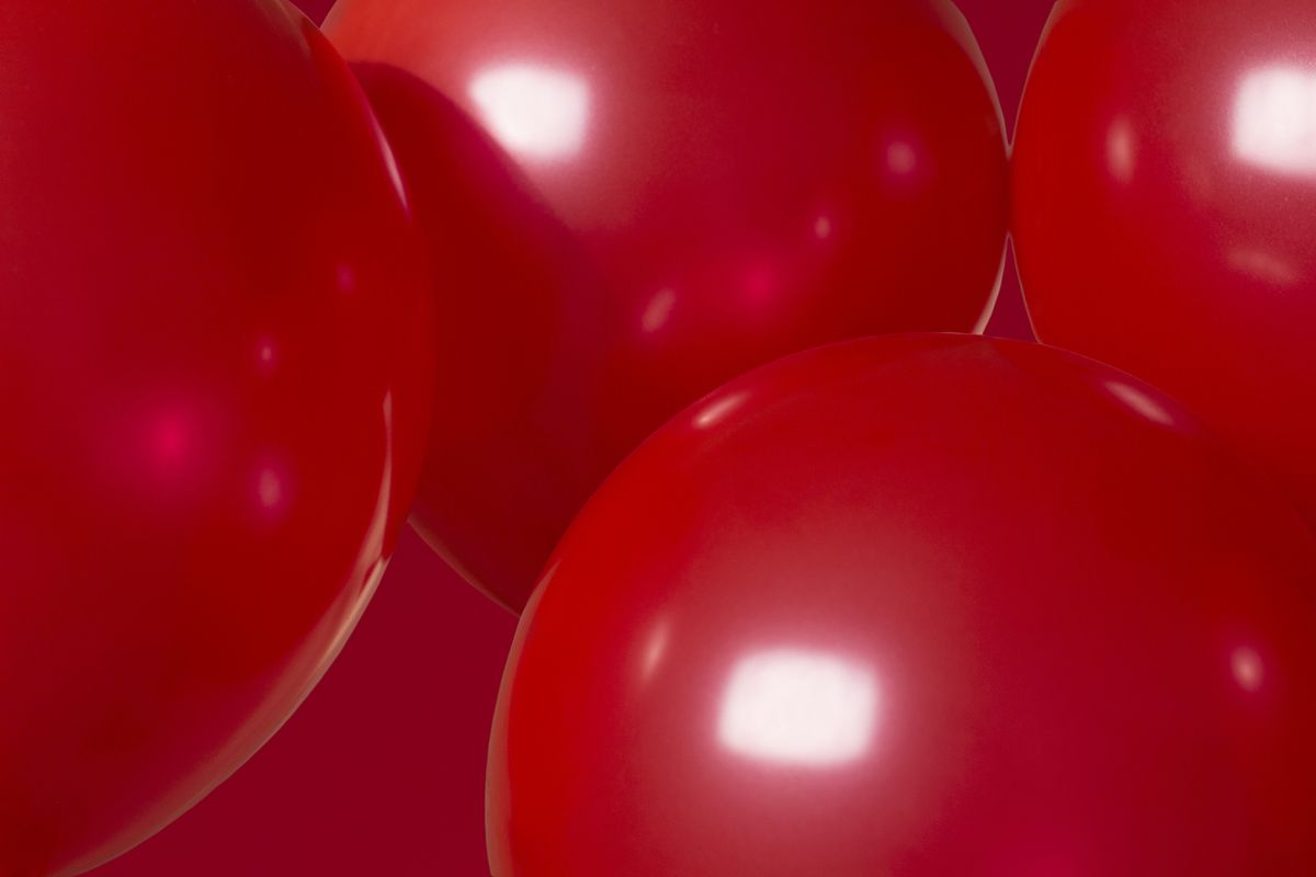 close up of red balloons