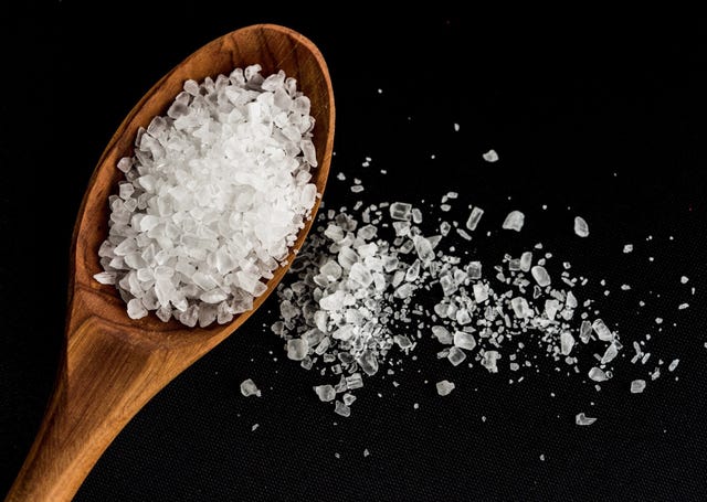Close-Up Of Rock Salt On Black Background